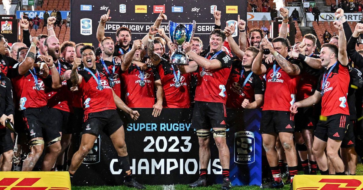 The Crusaders celebrate their Super Rugby Pacific 2023 championship victory in Hamilton, New Zealand, on, June 24, 2026. after defeating the Chiefs at FMG Stadium, Waikato. Captain Scott Barrett lifts the trophy as teammates erupt in jubilation, marking the Crusaders' seventh consecutive title.. Photo: Hannah/Getty Images Sport. ©Getty Images