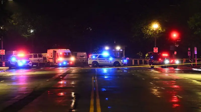 Police cars block streets outside the White House after Saturday's Shooting
