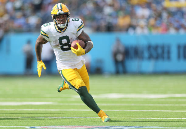 Josh Jacobs #8 of the Green Bay Packers runs against the Tennessee Titans during the fourth quarter at Nissan Stadium