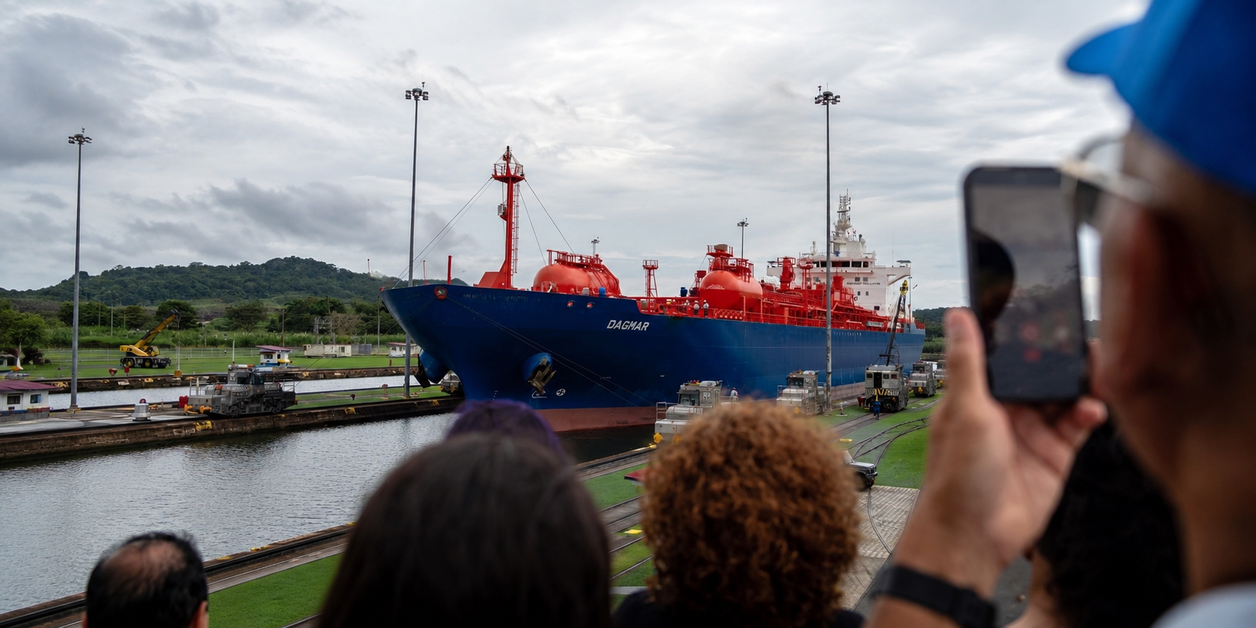 A cargo ship transiting Panama Canal as visitors watch in Panama. © Zenger.News