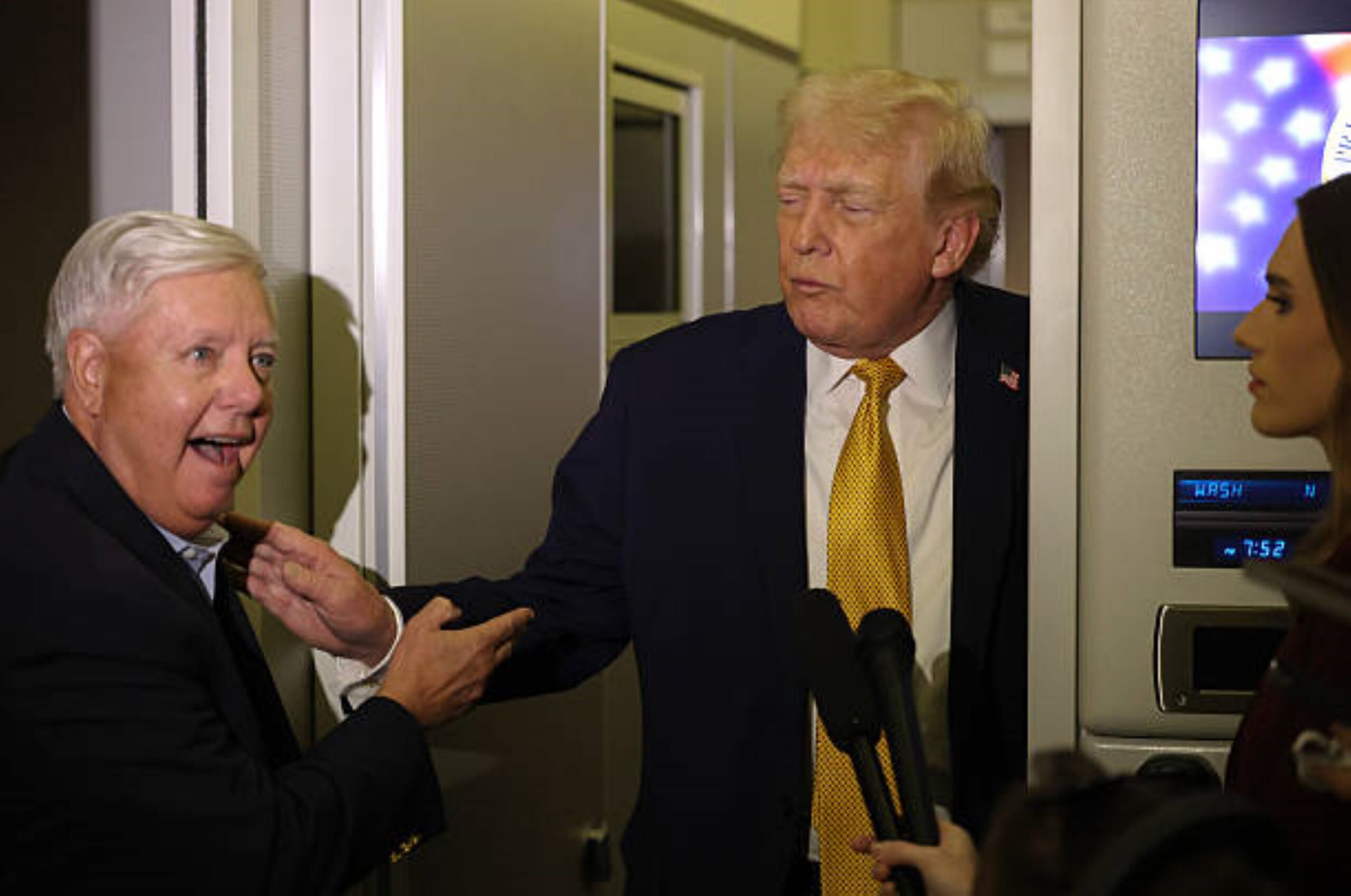 President Donald Trump (right) and Senator Lindsey Graham (left) exchange a gesture in Washington, DC, on January 4, 2026 at 6:59 PM. Photo: Joe Raedle/Getty Images. © Getty Images.