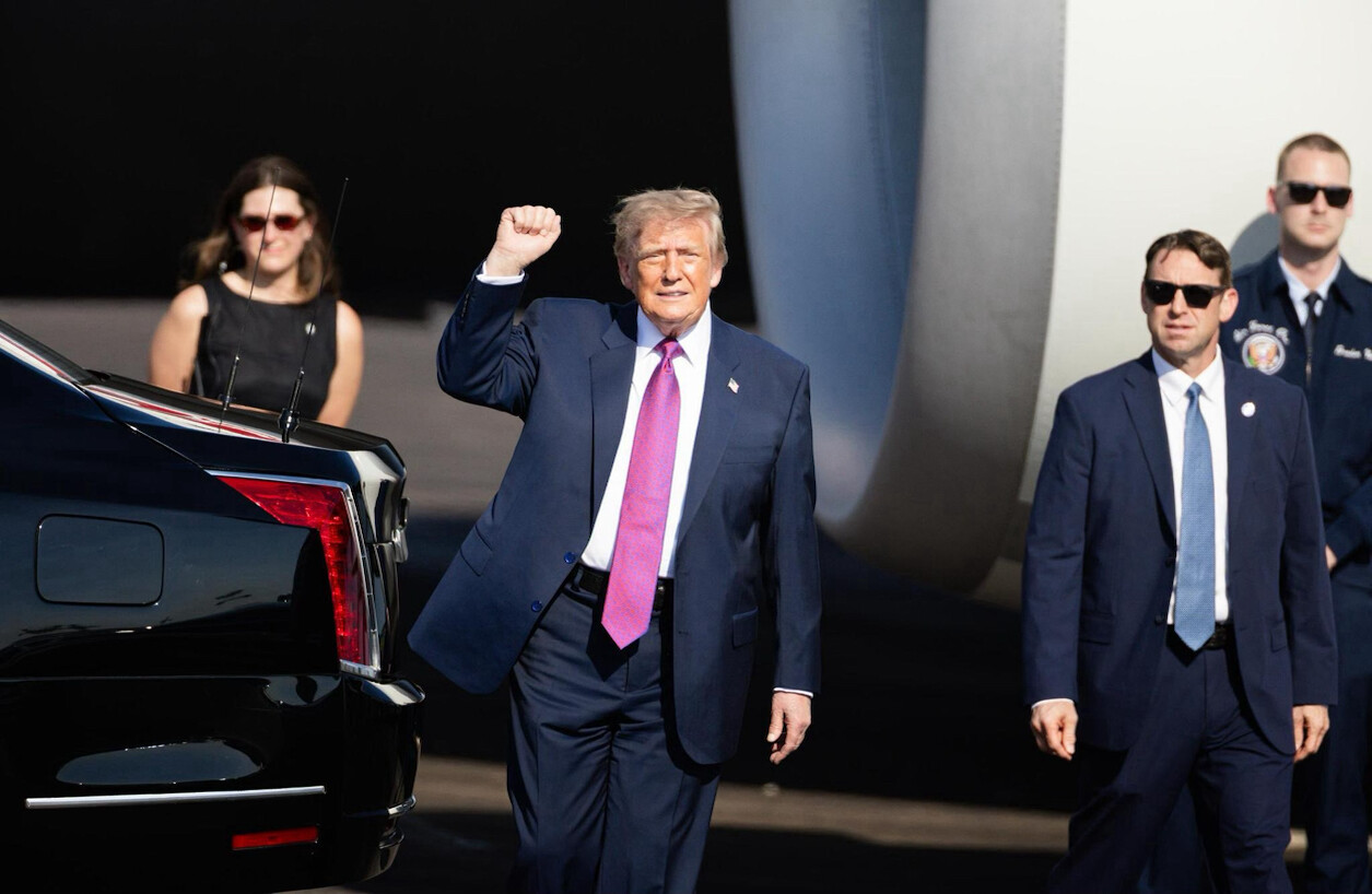 47th President of the United States Donald J. Trump raises his right fist at an airport tarmac on 08/29/2026.