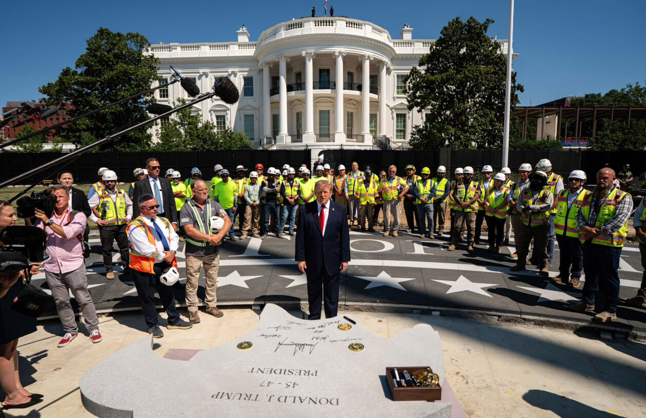 President Donald J. Trump stands beside a commemorative stone at the White House in Washington D.C.